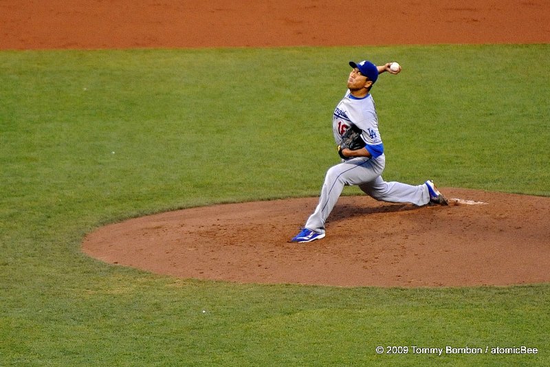 Dodgers starter pitcher Hiroki Kuroda eyes are closed as he releases... very Zen-like! May the force be with the ball.