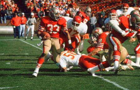 Roger Craig slips the K.C. Chiefs defense