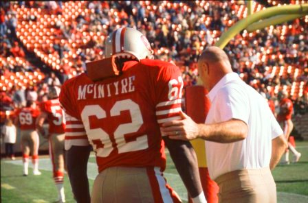 Guy McIntyre consults with Coach 