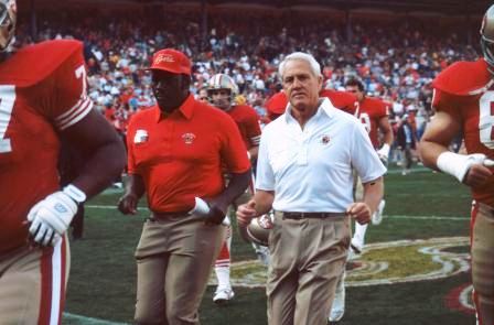 Coach Bill Walsh head to the locker room for half-time.